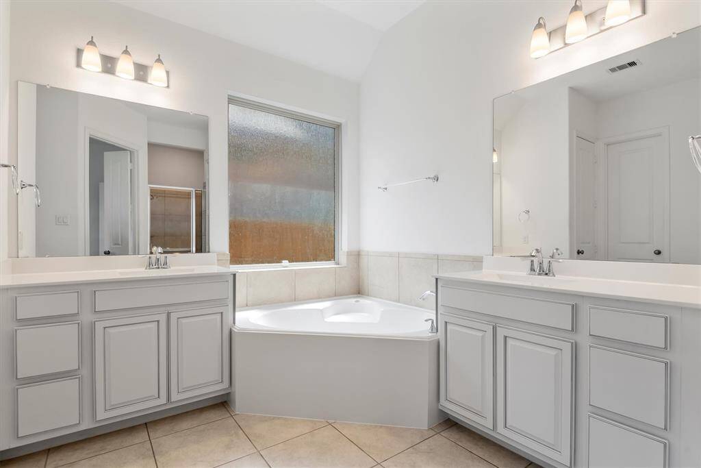 Ensuite bathroom with dual vanities.