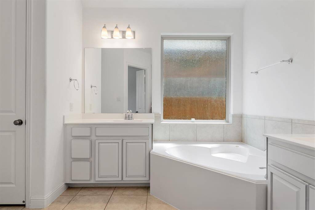 Dual vanities and soaking tub.