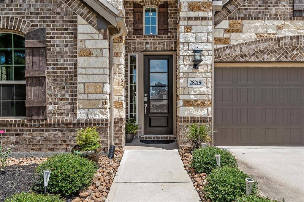 Grand entrance with walkway to sidewalk