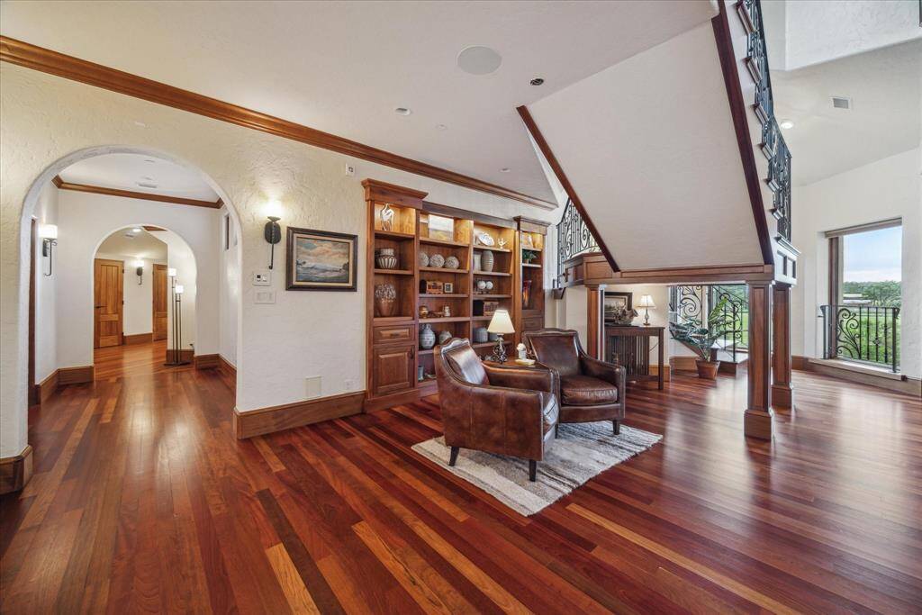Nestled underneath the floating third floor staircase is a quaint library with built-in bookcases.