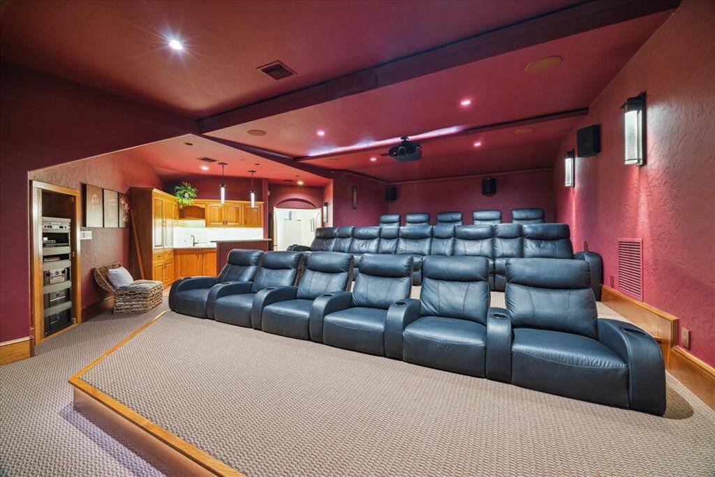 The movie theatre offers lounge seating for 16-20! Super Bowl parties or movie marathons are easy to host here with the added convenience of the wet bar kitchenette featuring a refrigerator and counterspace. The Marantz sound system moves you from simply watching and listening to a fully immersive experience.