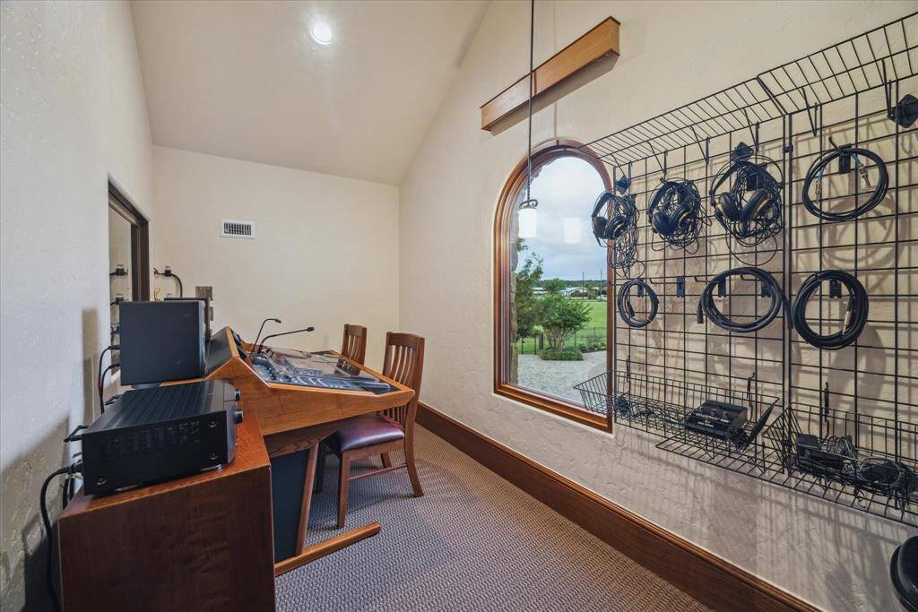 This isolation booth is used as the control room, a private space secluded just off the studio itself where recordings can be made, mixed and manipulated. Adjacent to this space is the service lift elevator for conveniently transporting equipment or heavy furniture. The studio boasts a kitchenette with sink, dishwasher, icemaker and refrigerator.