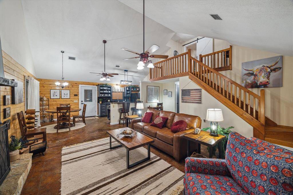 An independent, free-standing 1680 square foot guest house is situated beyond the resort style pool. A fireplace serves as the focal point in the living area adorned with stamped concrete flooring and towering cathedral ceiling. It boasts a metal roof.
