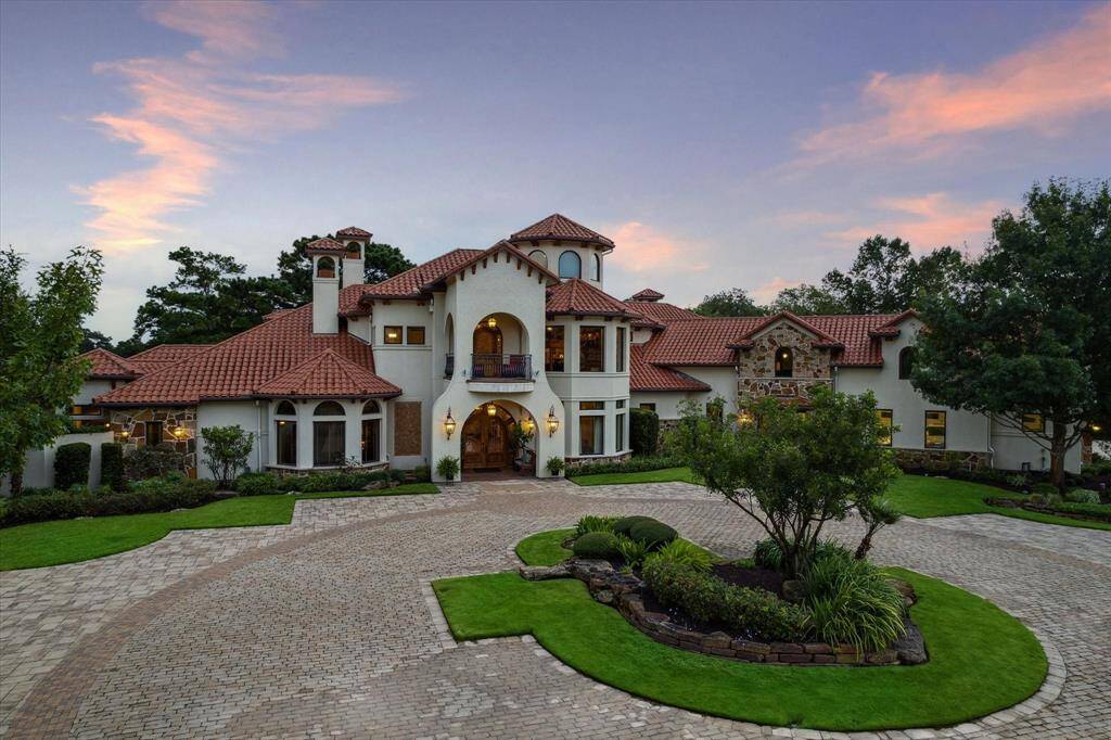 Impeccably manicured grounds set off this expansive Mediterranean estate beautifully accented by the clay tile roof contrasting with the crisp stucco. This hacienda, adorned with 4 balconies and surrounded by courtyards, patios and loggias, is particularly suited for the Houston climate where outdoor living is a year-round luxury.