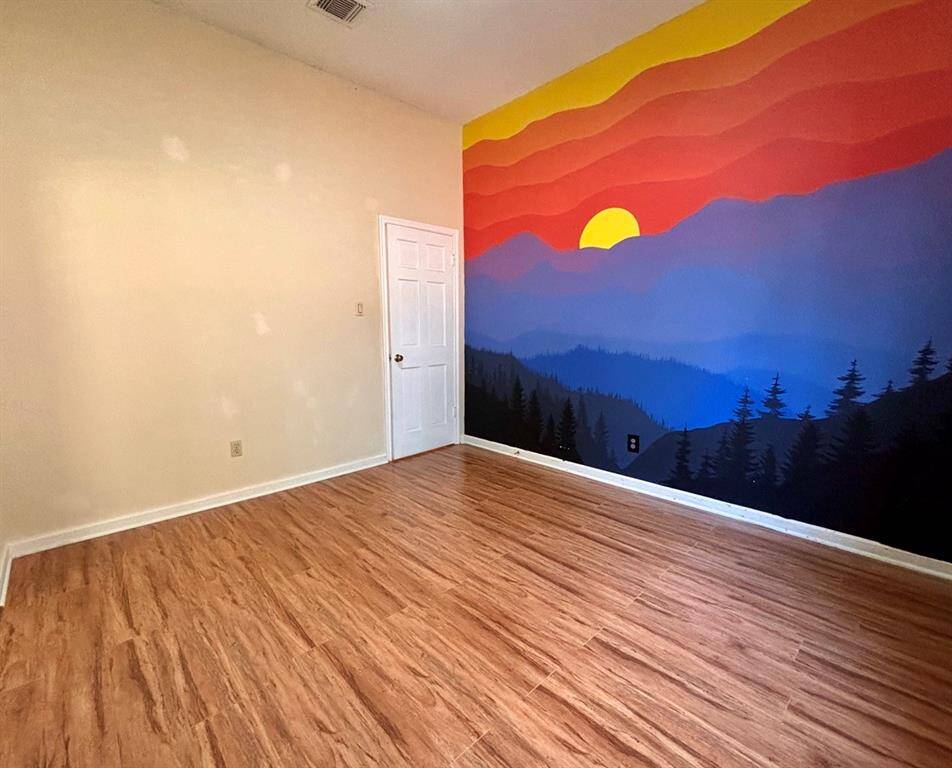 A light-filled, roomy nursery or guest bedroom with a warm and cheerful atmosphere.