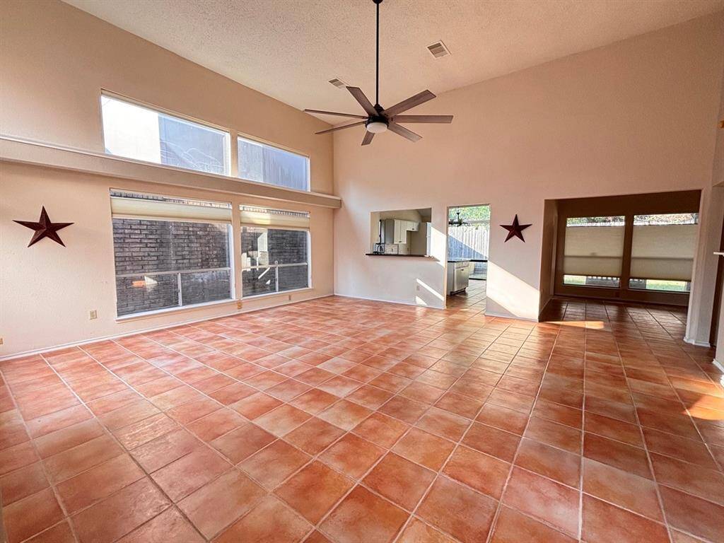 A big, bright living room greets you as soon as you walk in
