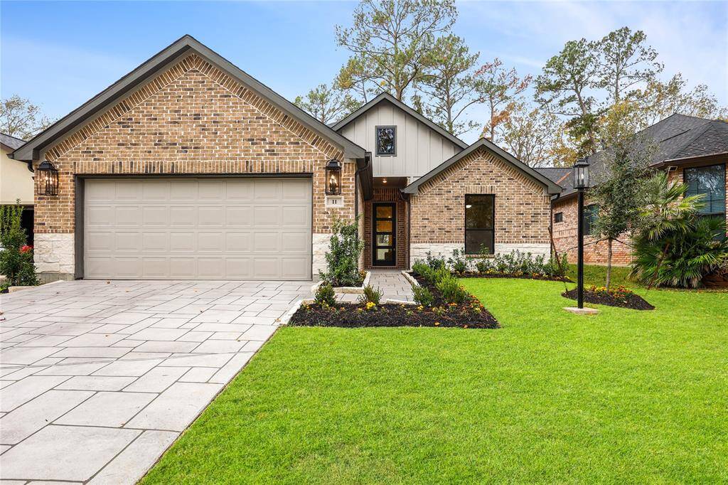 Incredible Curb Appeal with stamped concrete driveway, and upgraded landscaping.
