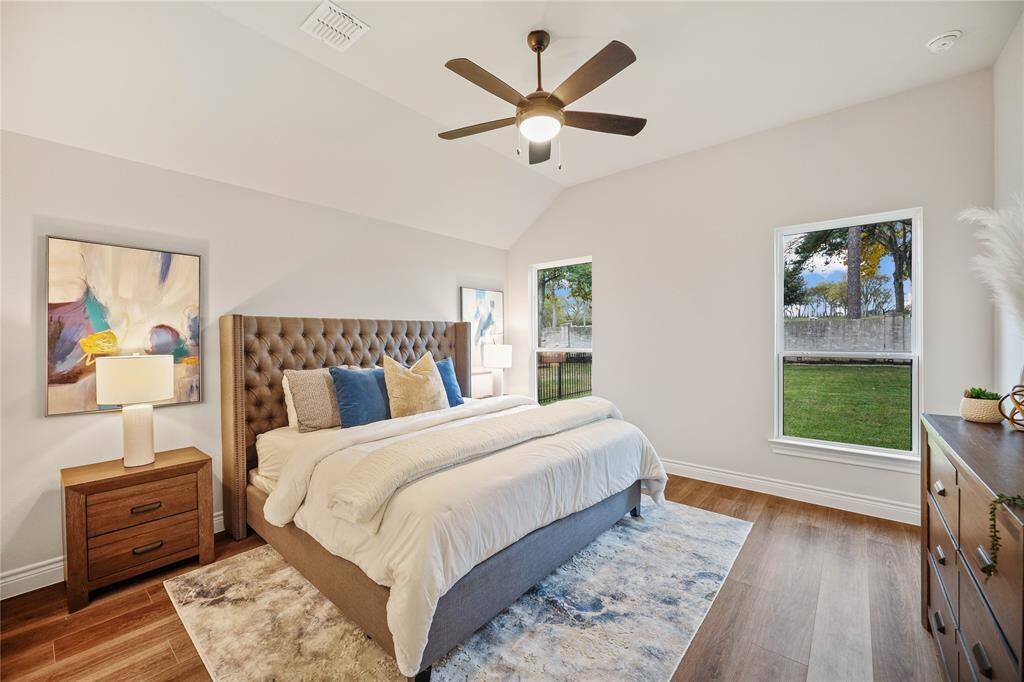 Oversized Master Bedroom showing a king size bed.