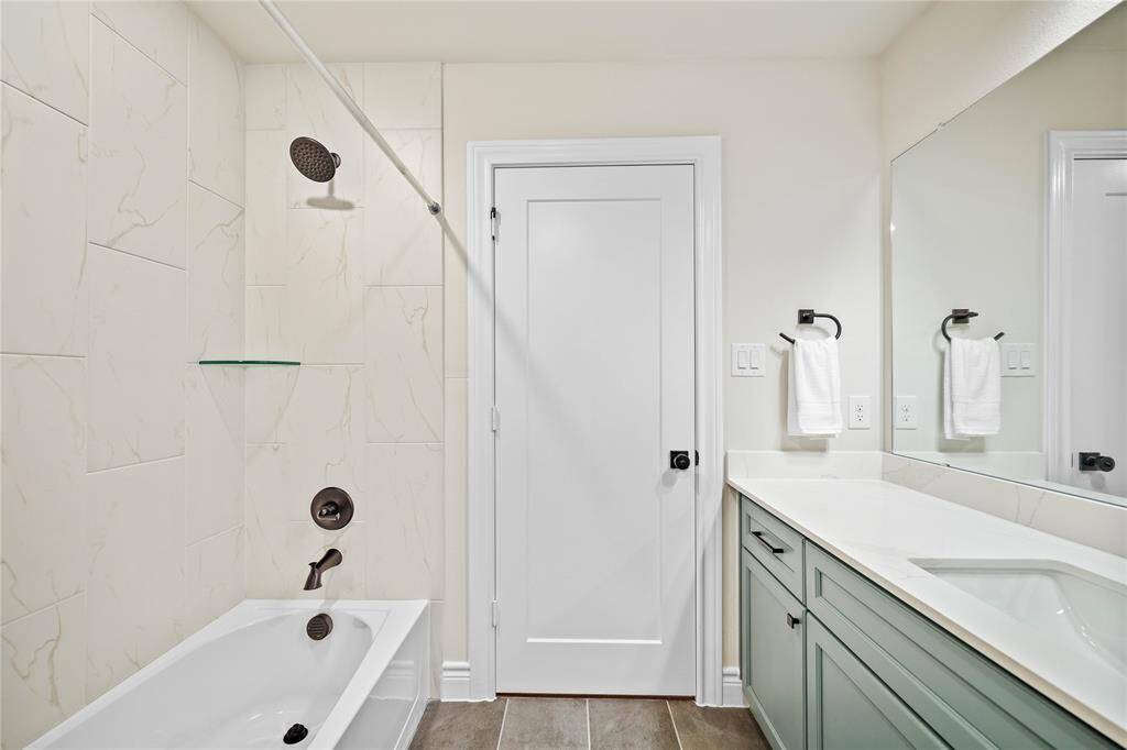 Tile to the ceiling in the Hall Bath.
