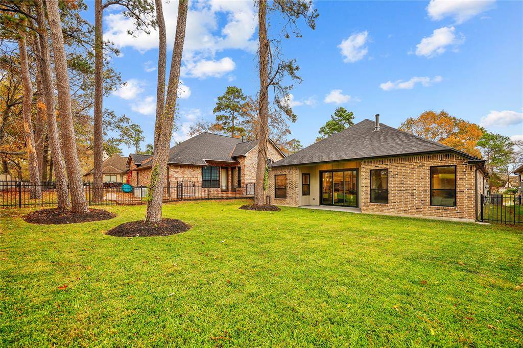 Oversized backyard with mature trees.   Sit out on your patio and enjoy the views of the golf course.