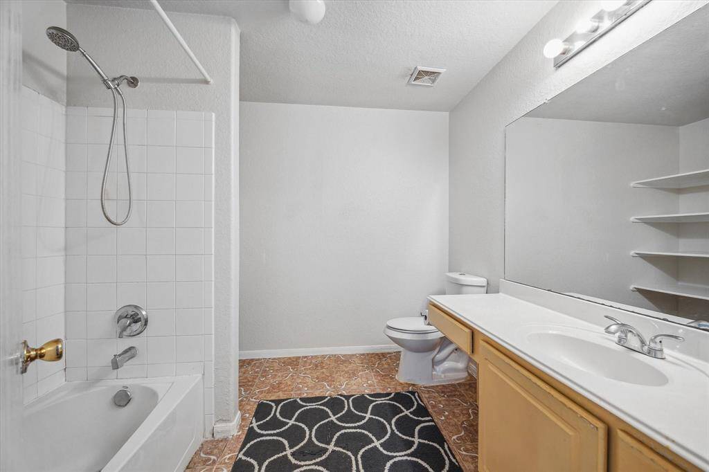 Primary bathroom with shelving
