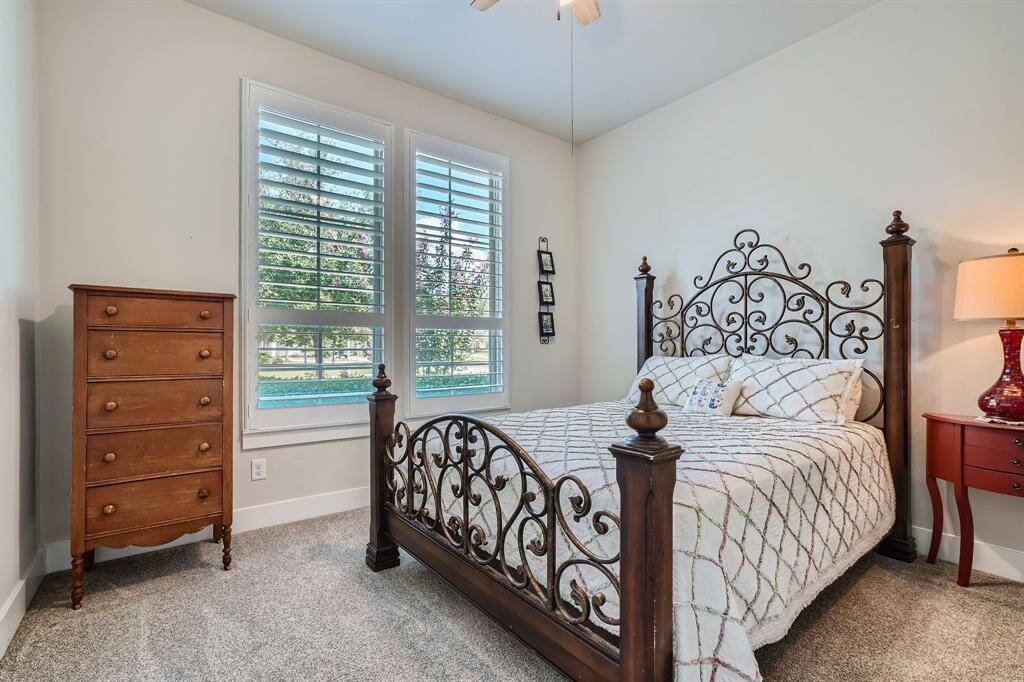 Very roomy secondary bedroom downstairs at the front of the home with even more space tucked away out of view
