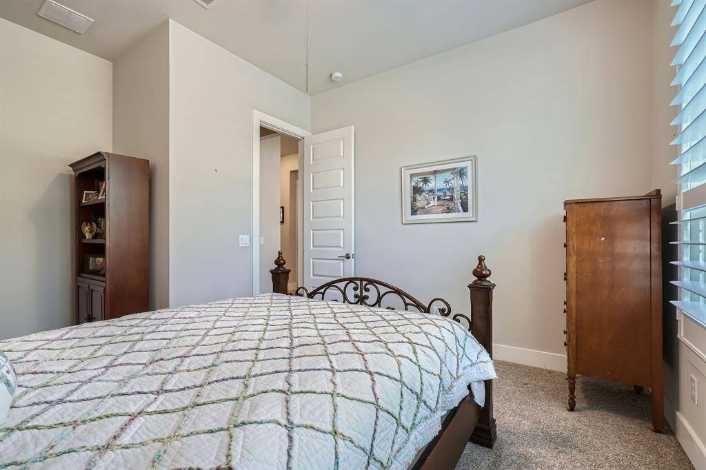 Another view of the well lit secondary bedroom