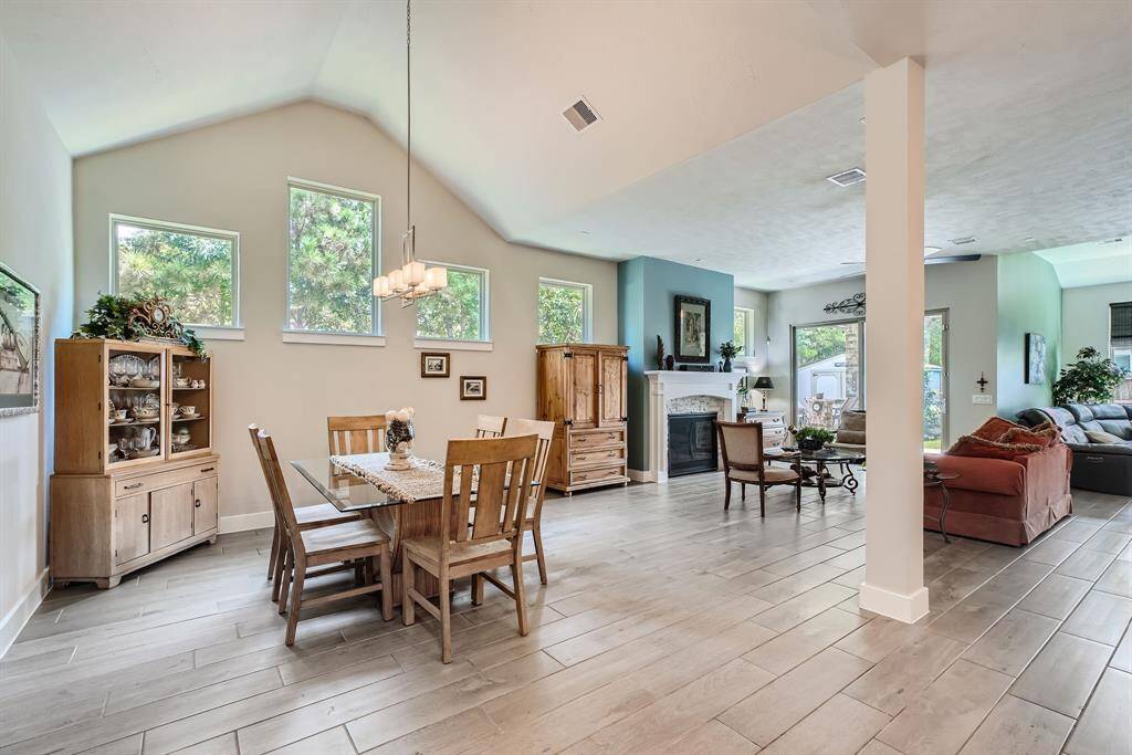 Bright open floor plan with beautiful wood-look tile flooring throughout