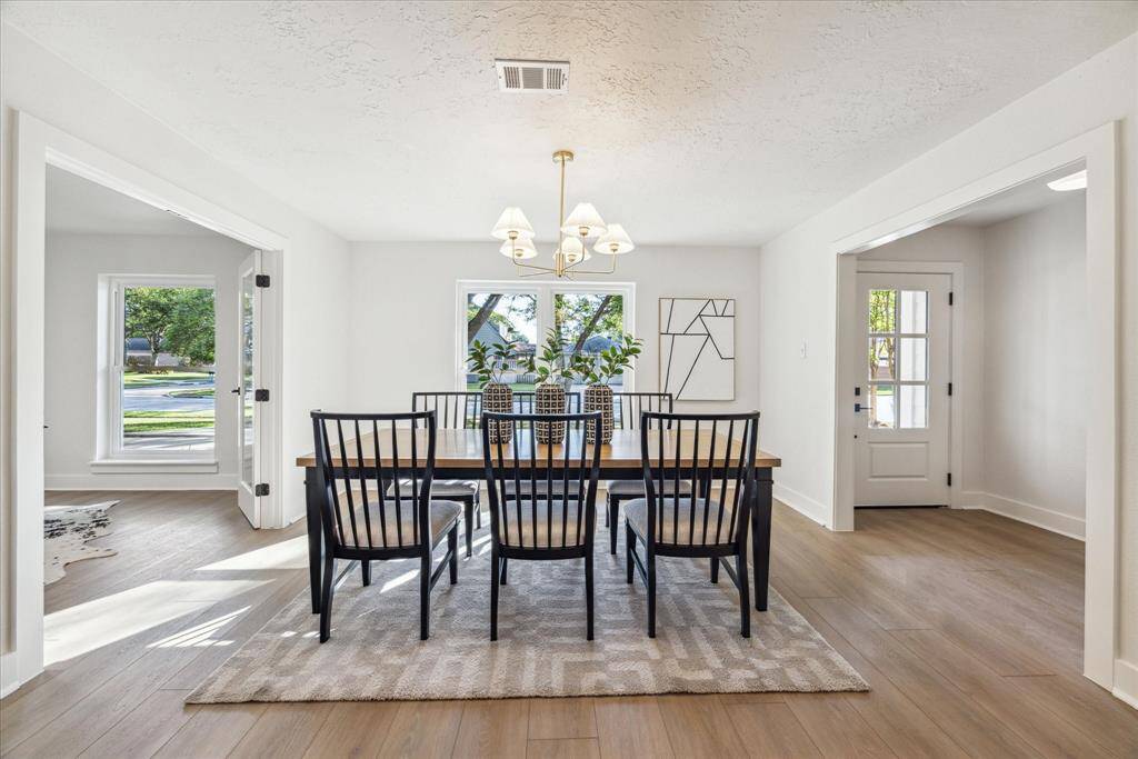 THE DINING ROOM FEATURES A CUSTOM CHANDELIER. ARE YOU READY TO HOST YOUR PRIVATE DINNER PARTIES?