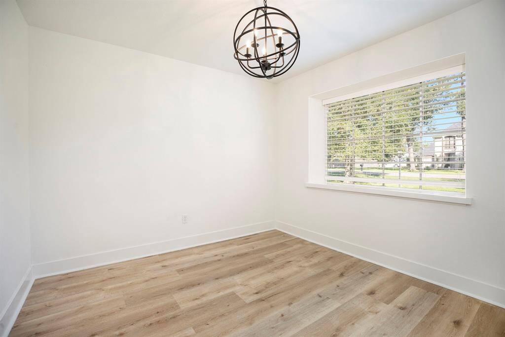 Bright, inviting dining space with abundant natural light at the home's entrance.