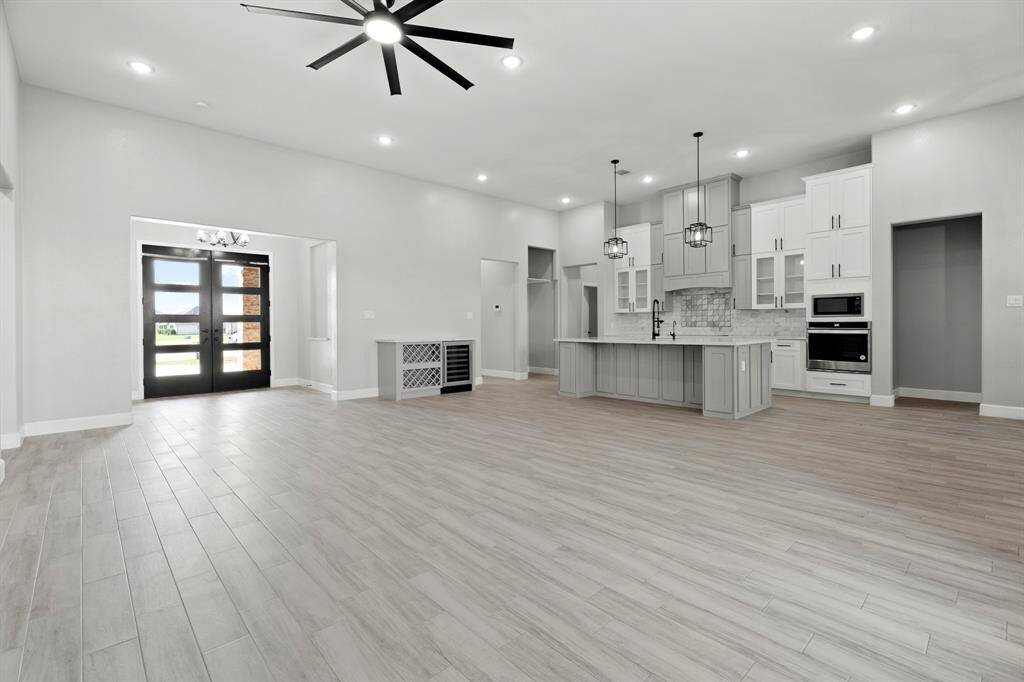 Enjoy a view from the living room looking towards the kitchen and front of the home.