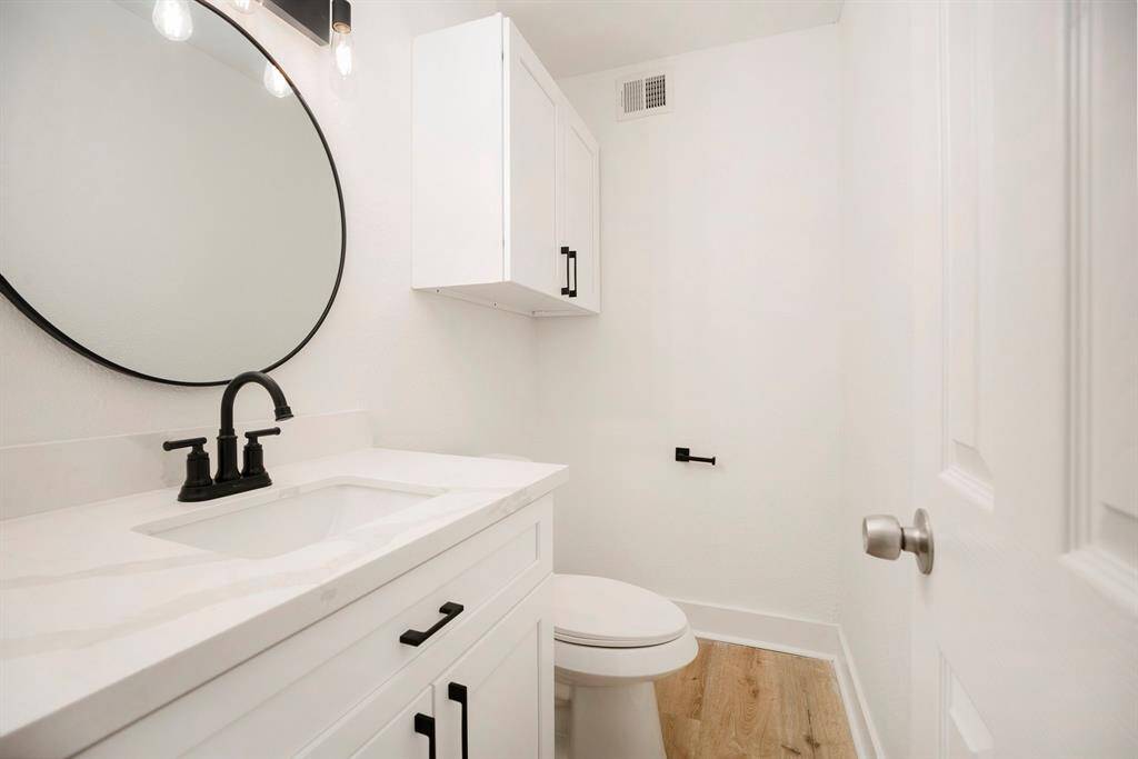 Elegant guest powder room on main level for convenience and style.