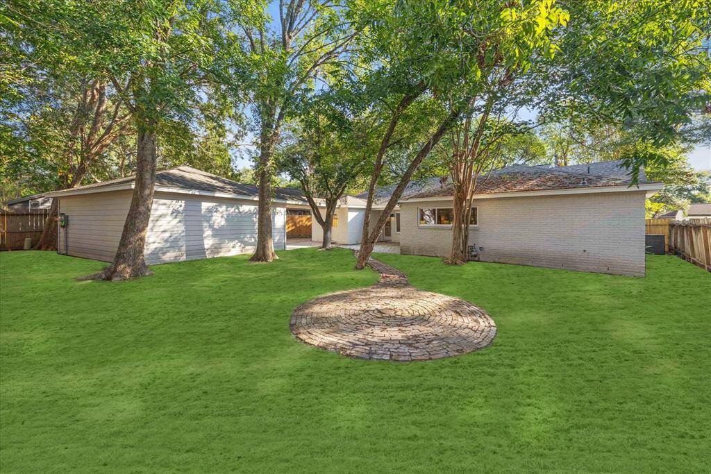 ANOTHER VIEW OF THE BACKYARD WITH PLENTY OF SPACE FOR PETS AND KIDDOS TO PLAY.