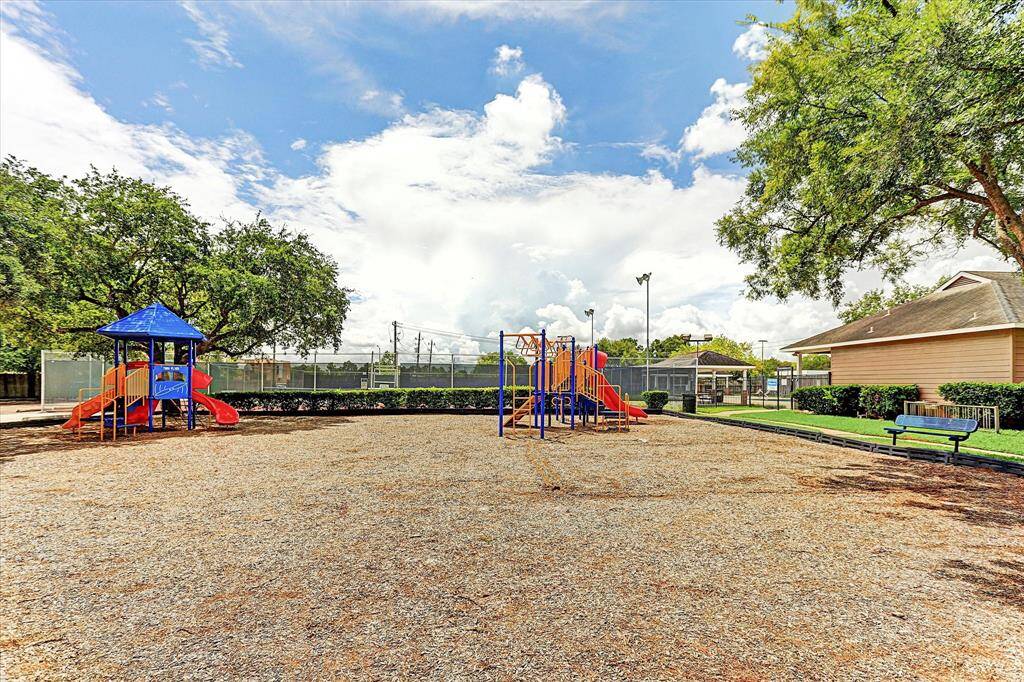 PLAYGROUND AND LIGHTED TENNIS COURTS BEYOND.