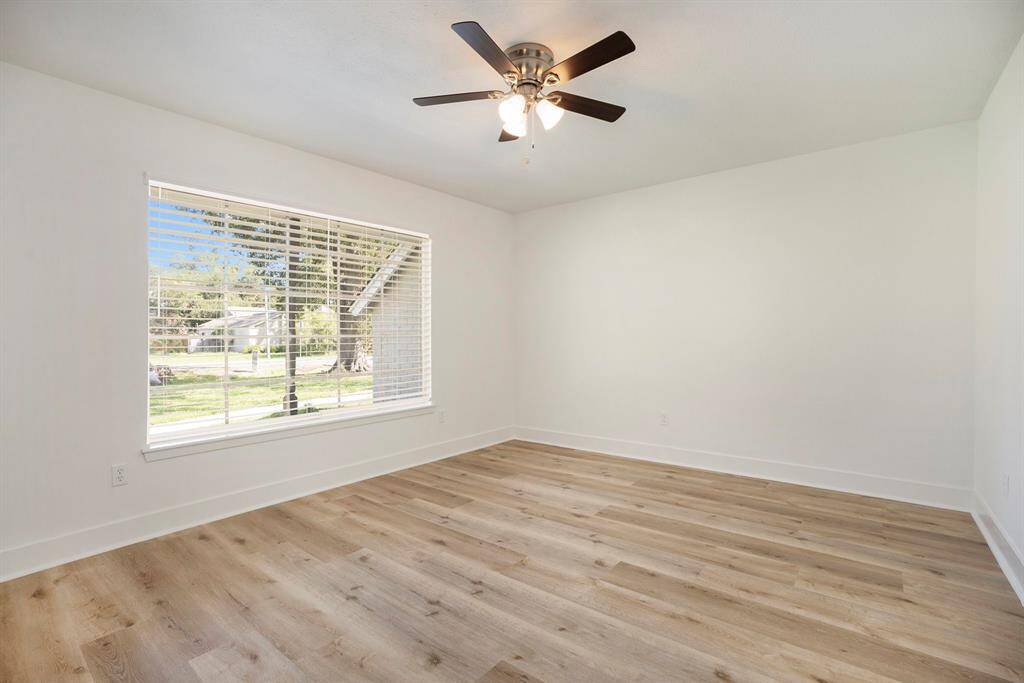 Versatile home office or flex room with natural light, immediately to your left upon entry.