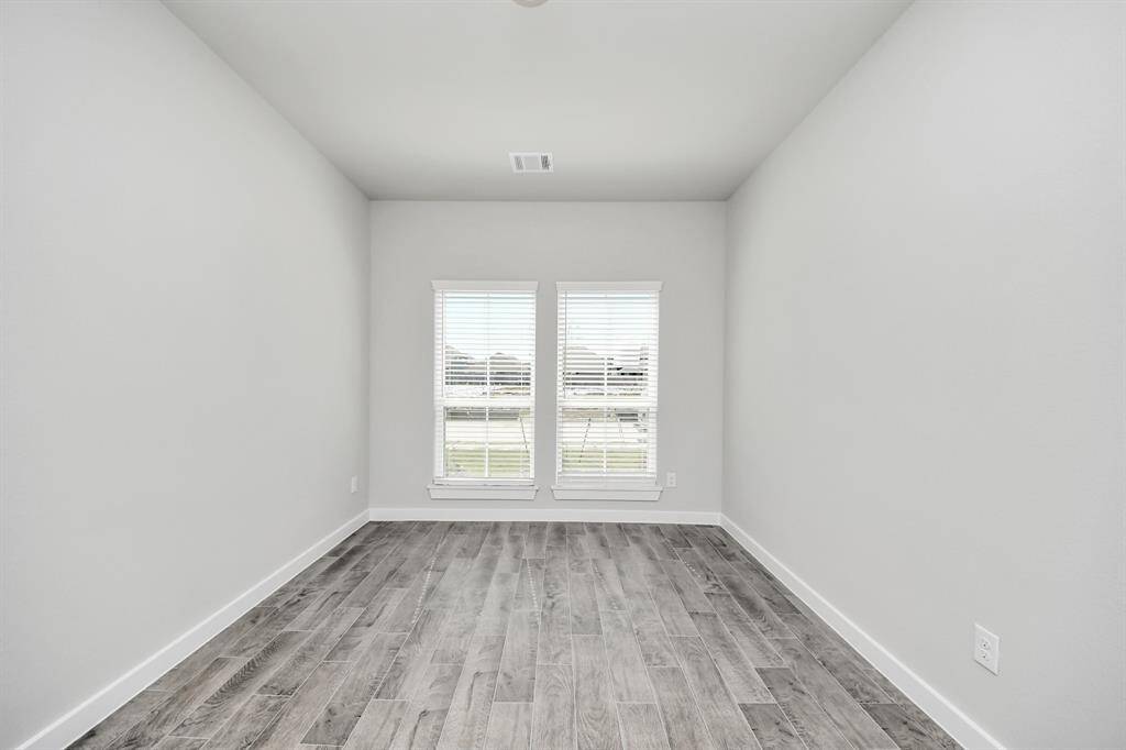 Make memories gathered around the table with your family and friends! This spacious dining room features elegant flooring, custom paint, and adjacent to family room and kitchen for open concept feel.