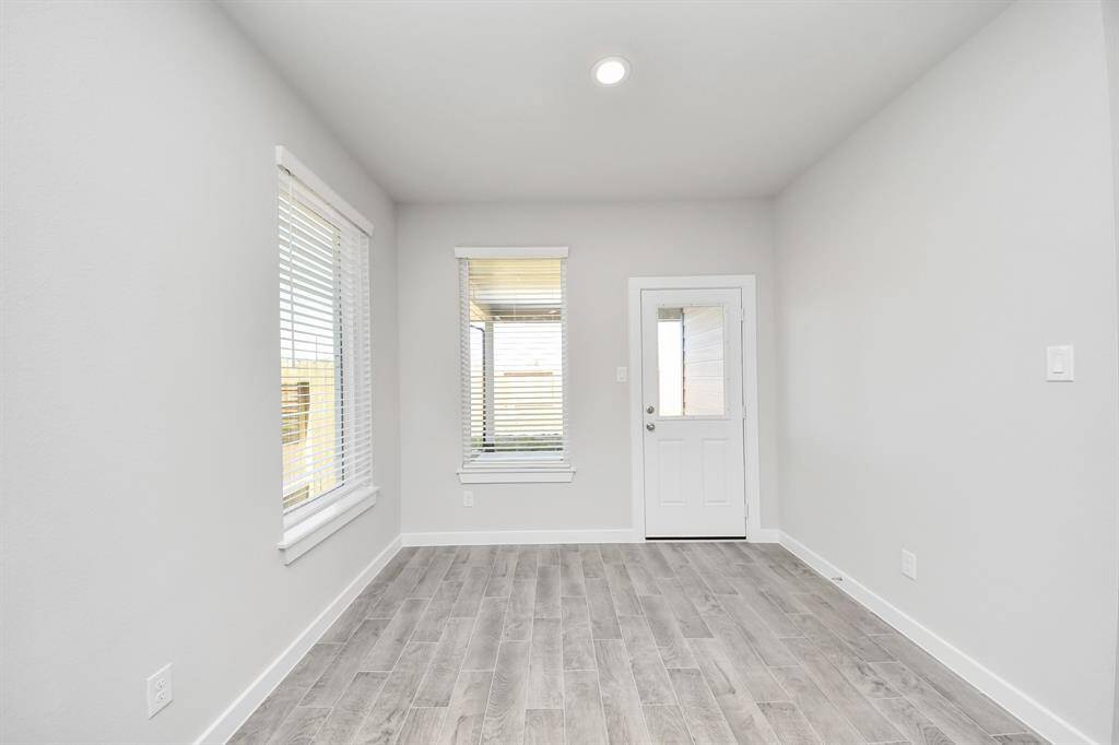 Come and unwind after a long day in this magnificent primary suite! This spacious room features plush carpet, warm paint, high ceilings and large windows with privacy blinds.