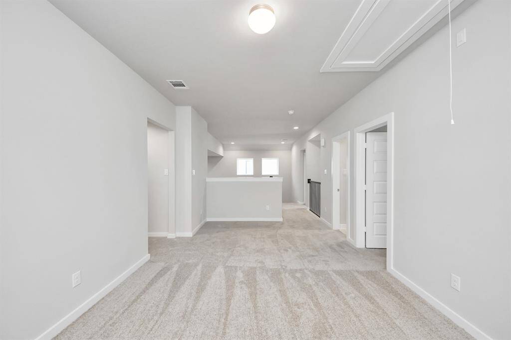 Generously sized secondary bedrooms featuring spacious closets, soft and inviting carpeting underfoot, large windows allowing plenty of natural light, and the added touch of privacy blinds for your personal retreat.