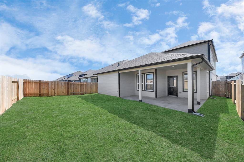 Experience outdoor living at its finest on this expansive covered patio, thoughtfully designed for BBQs and delightful outdoor dining!