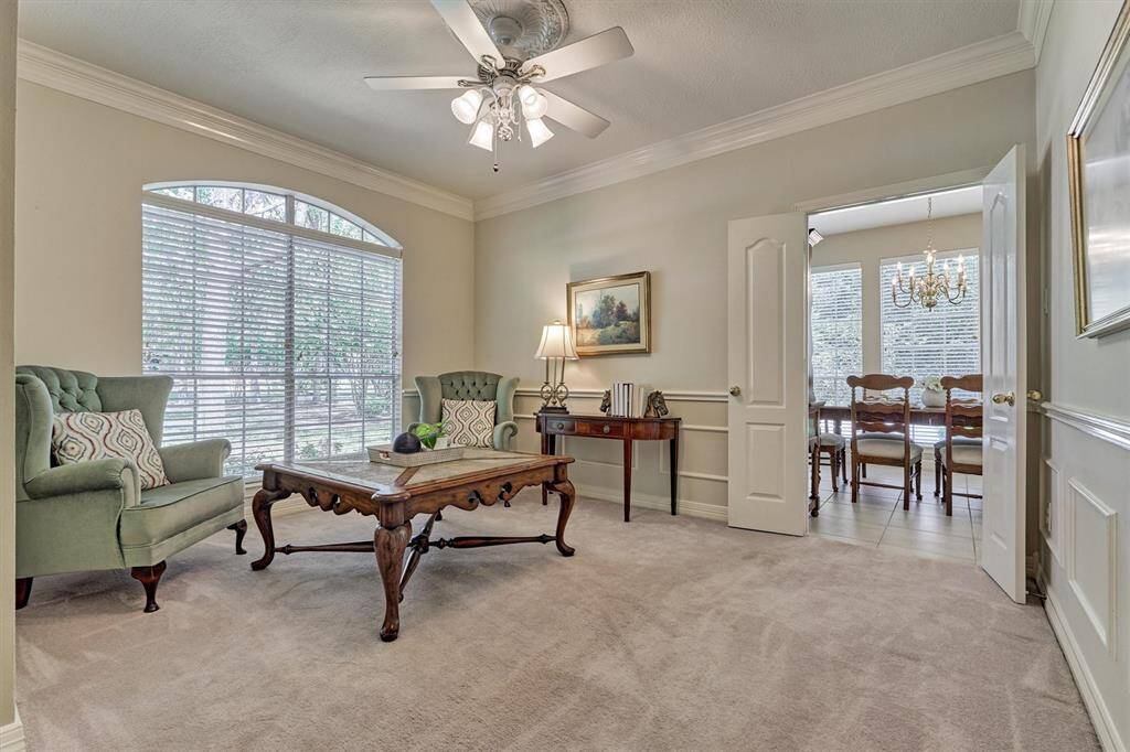 Formal living room on the left has elegant molding