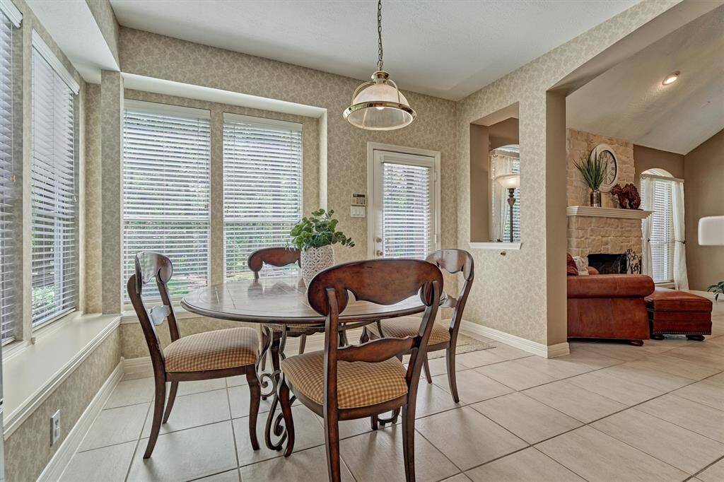 Backyard bay window views and back door to patio surround the Breakfast area