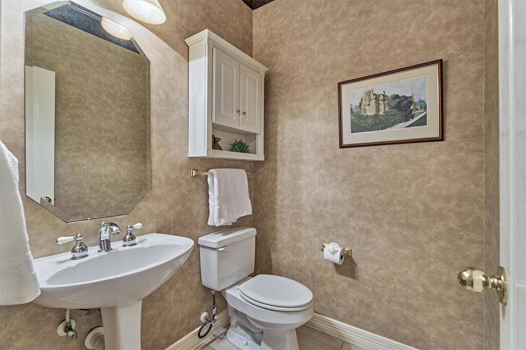 Powder room off foyer on first floor