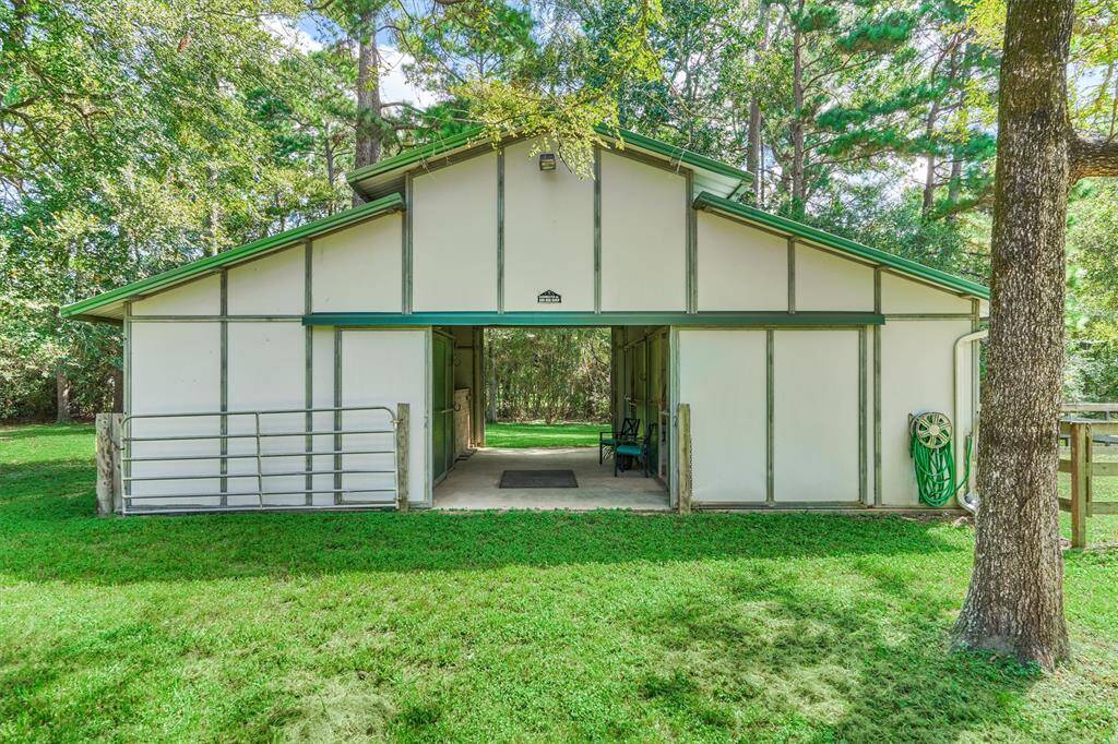 Barnmaster barn with 2 stalls, tack room, hay/storage area, and walk-outs