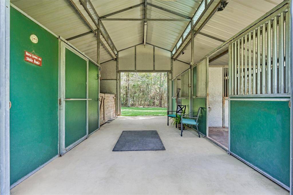 Barnmaster barn with 2 stalls, tack room, hay/storage area, and walk-outs
