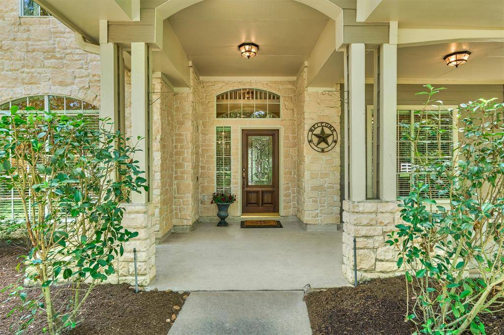 Expansive front porch wraps around for more amazing views