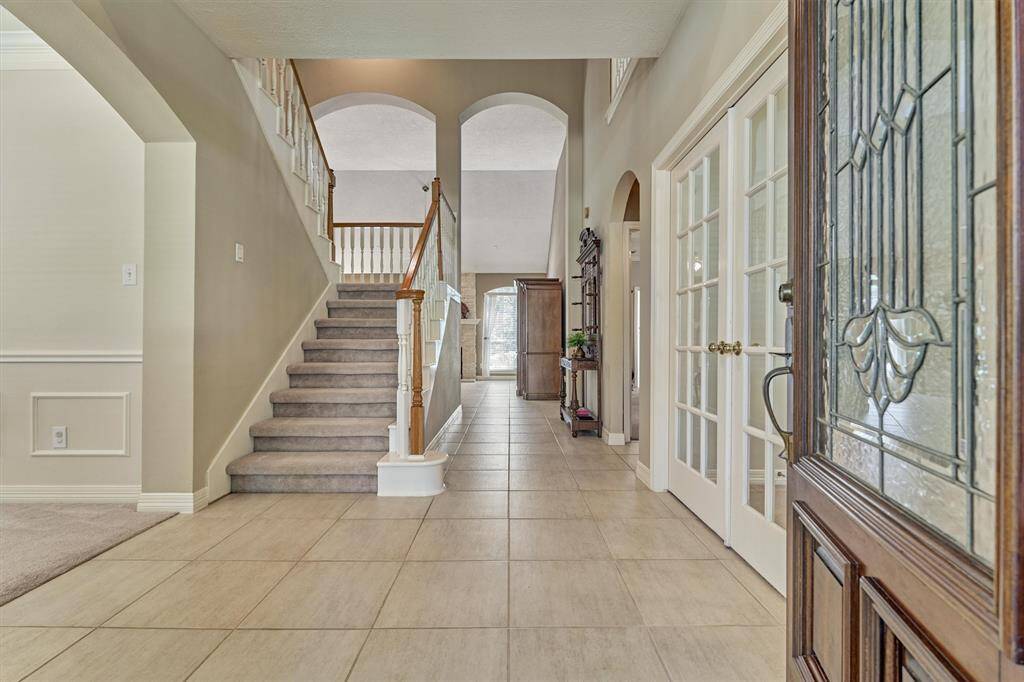 Welcome! Step into a world of refined living with 4 bedrooms, 3 full and 1 half bath, formal living and dining rooms, an office, and an upstairs game room.