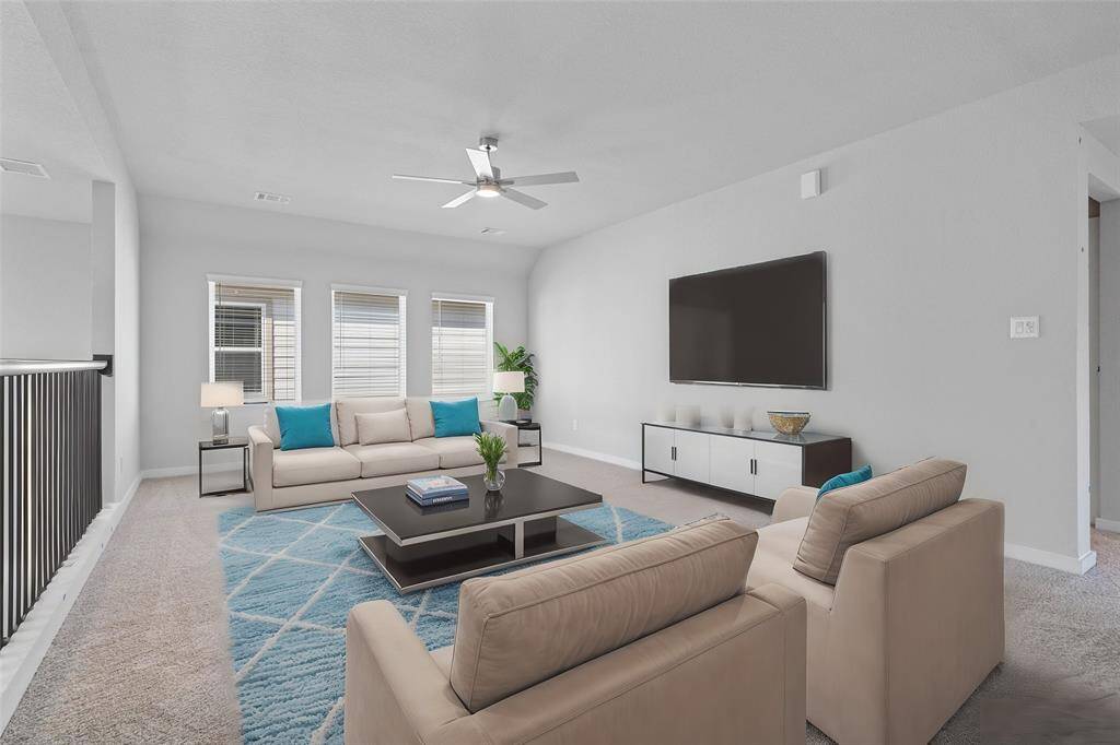 Come upstairs and enjoy a day of leisure in this fabulous game room! This is the perfect hangout spot or adult game room, this space features plush carpet, high ceiling with ceiling fan, large windows w/privacy blinds, and neutral paint.