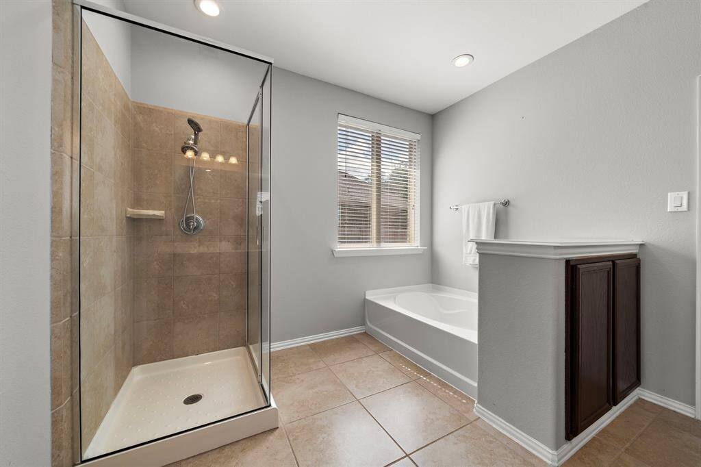 The primary bathroom also features a seperate walk-in shower and soaking tub.
