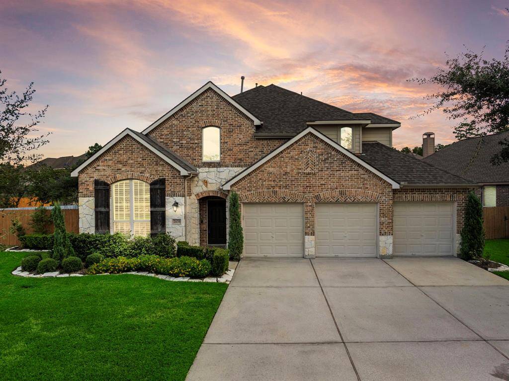 Stunni curb appeal and entryway featuring a true front facing 3 car garage.