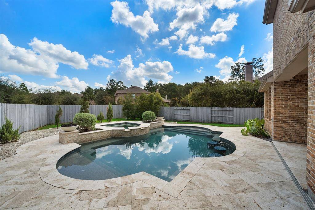 Notice the bar stools at the front of the pool.