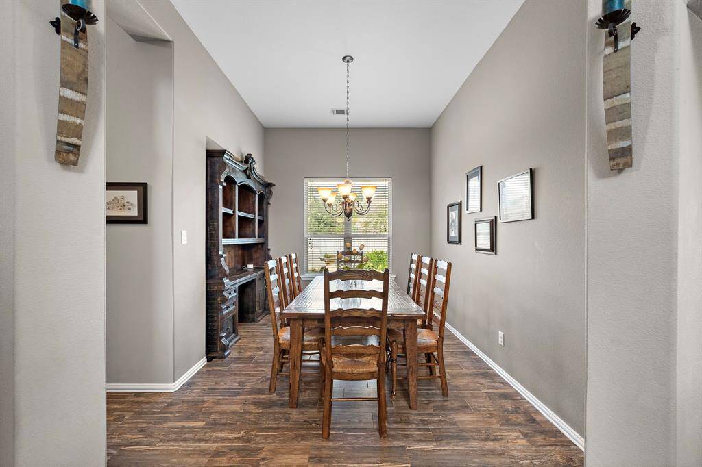 The formal dining room is also located off of the front entryway and features a bump out.