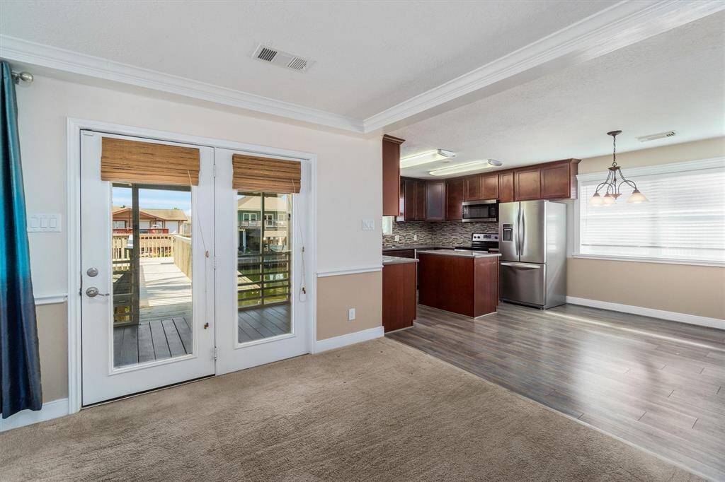 View of the open concept of the living area, dining area and kitchen. Just look at all the natural lighting