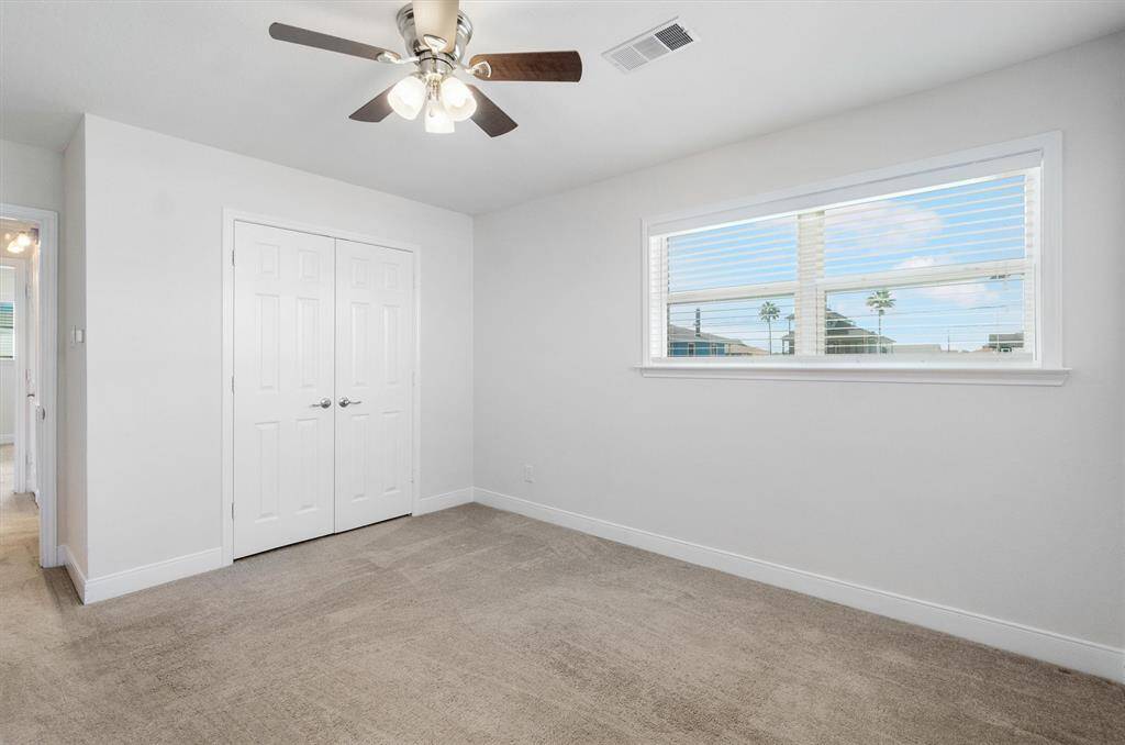 Another view of the primary bedroom