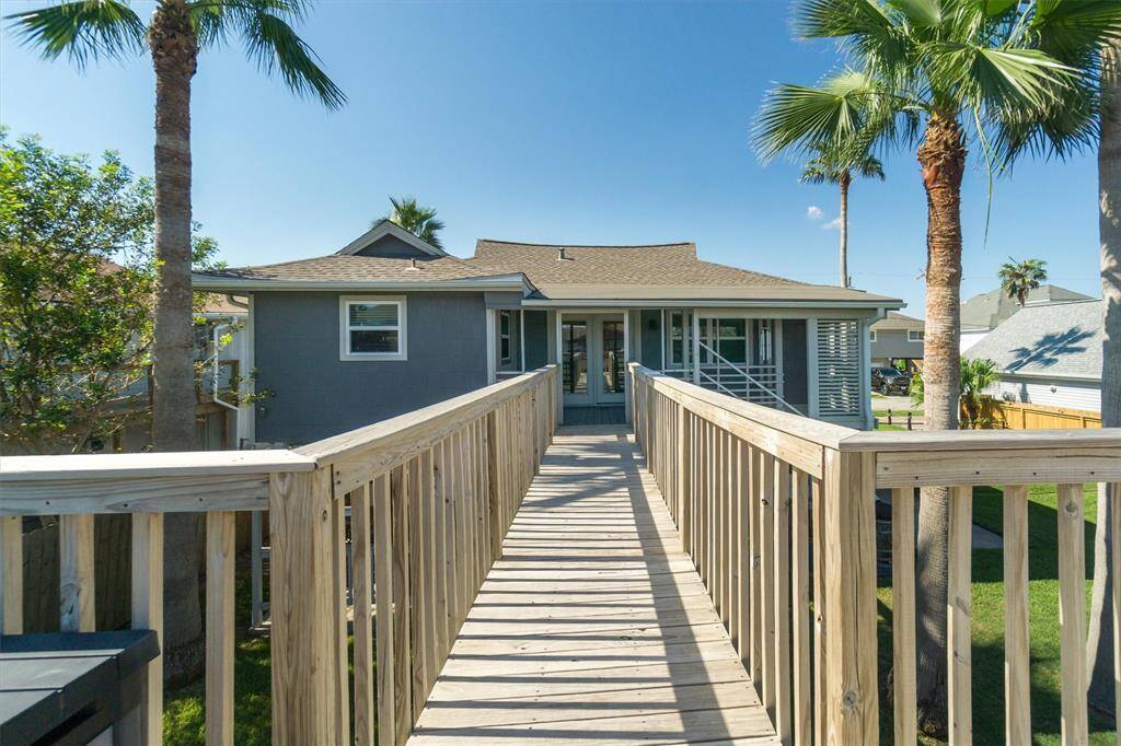 The catwalk from the upper party deck to the home. I love the Polynesian feel of the exterior of the home