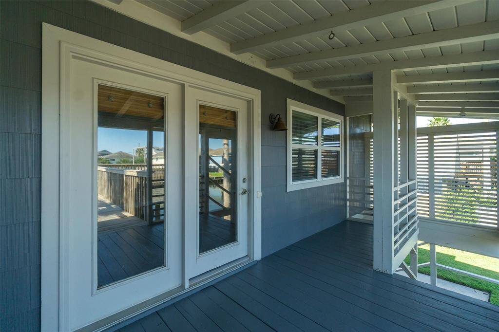 French door and a shady covered porch with privacy louvers