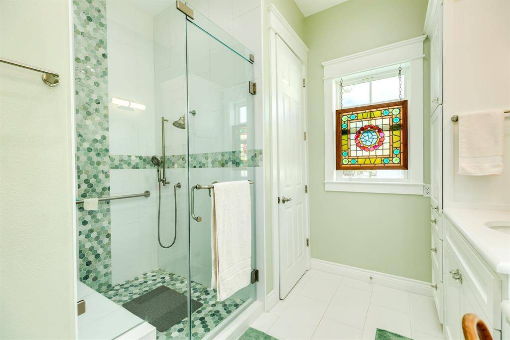 Walk-in shower in primary bath.