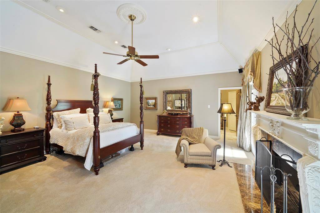 Spacious primary suite w/ rooms for a sitting area & your own personal fireplace.