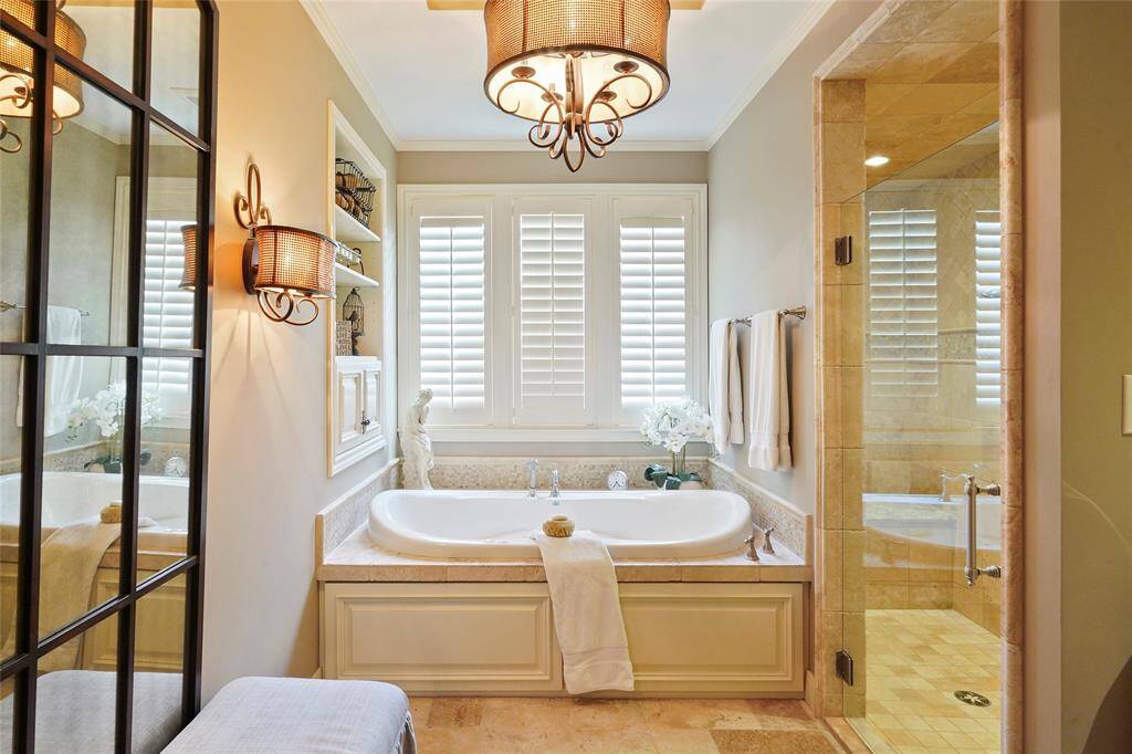 2 person whirlpool tub, windows w/ plantation shutters & a huge walk-in shower!