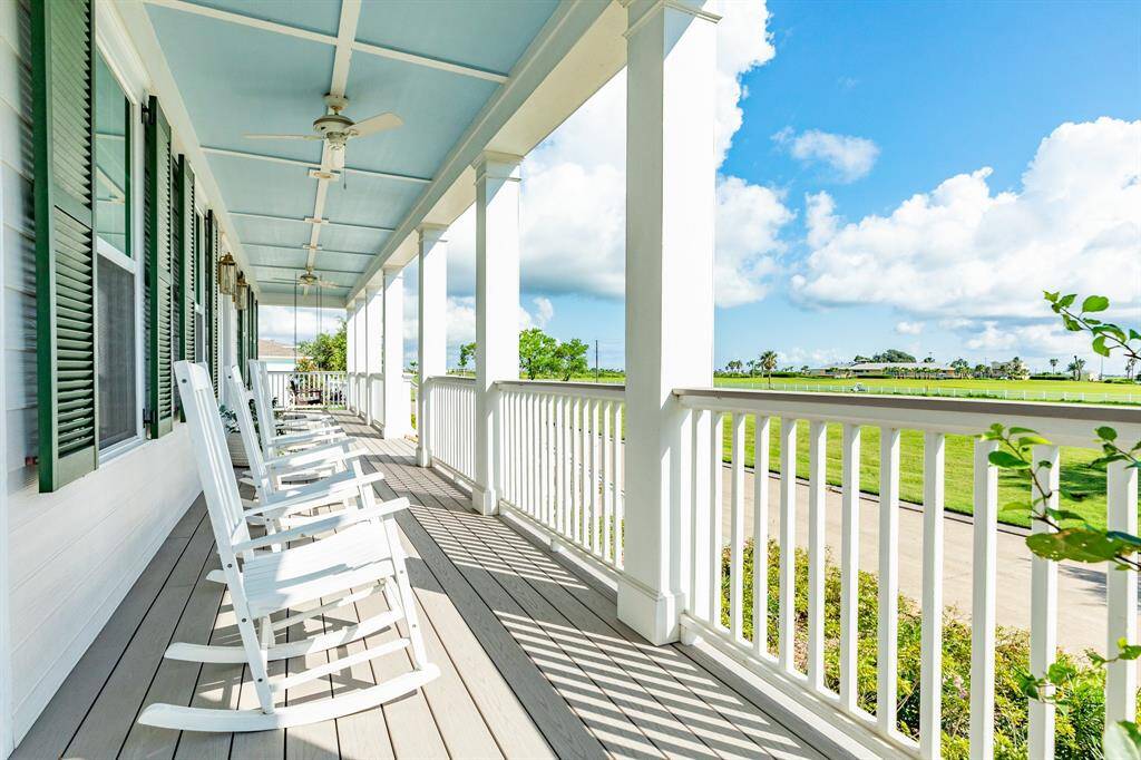 Relax and enjoy the breeze on the covered wrap around porch.