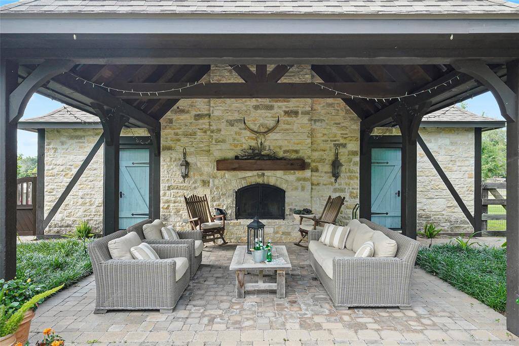 Outdoor living area w/ a fireplace!